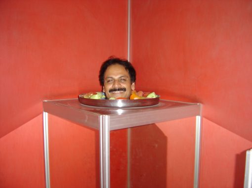 Optical illusion exhibit at the Science Museum in Bangalore during his Fulbright Scholarship tenure in India (2005)