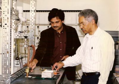 Dr. Edward H. Dowdye discussing the design of the gas manifold