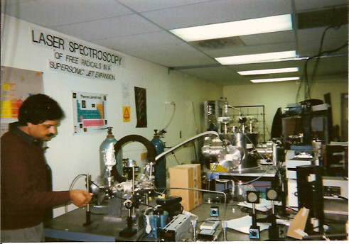 Professor Misra adjusting the gas flow for chemical kinetics experiments