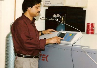 Professor Misra operating the  Questek Impulse Excimer Laser.