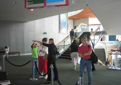Diane Pugel conversing with the exhibition attendees.