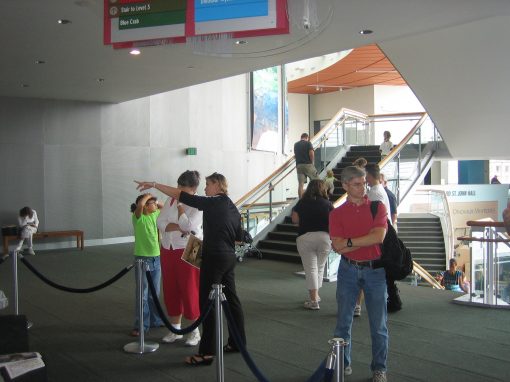 Diane Pugel conversing with the exhibition attendees.