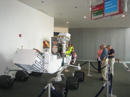 Attendees observing the rover model
