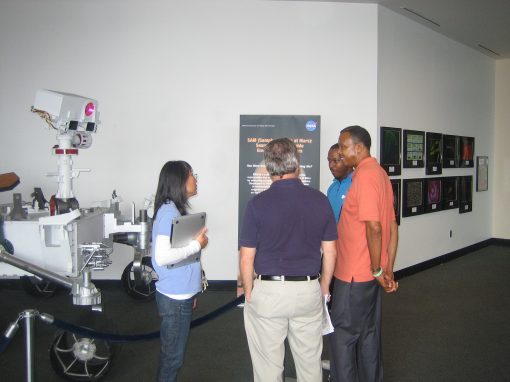 Florence Tan and Eric Lyness conversing with exhibition attendees