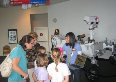 Florence Tan conversing with the exhibition attendees