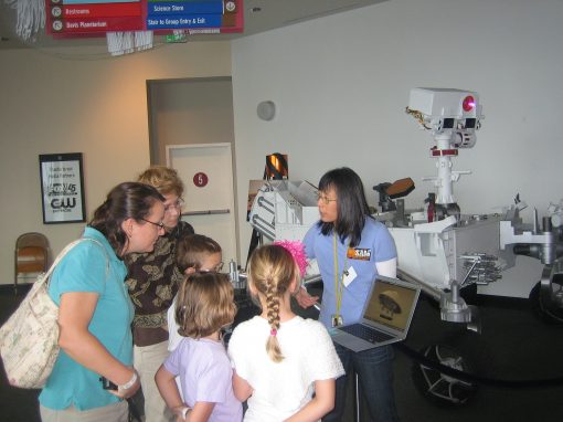 Florence Tan conversing with the exhibition attendees