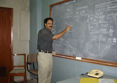Professor Misra at the blackboard in his office at TIFR (2005)